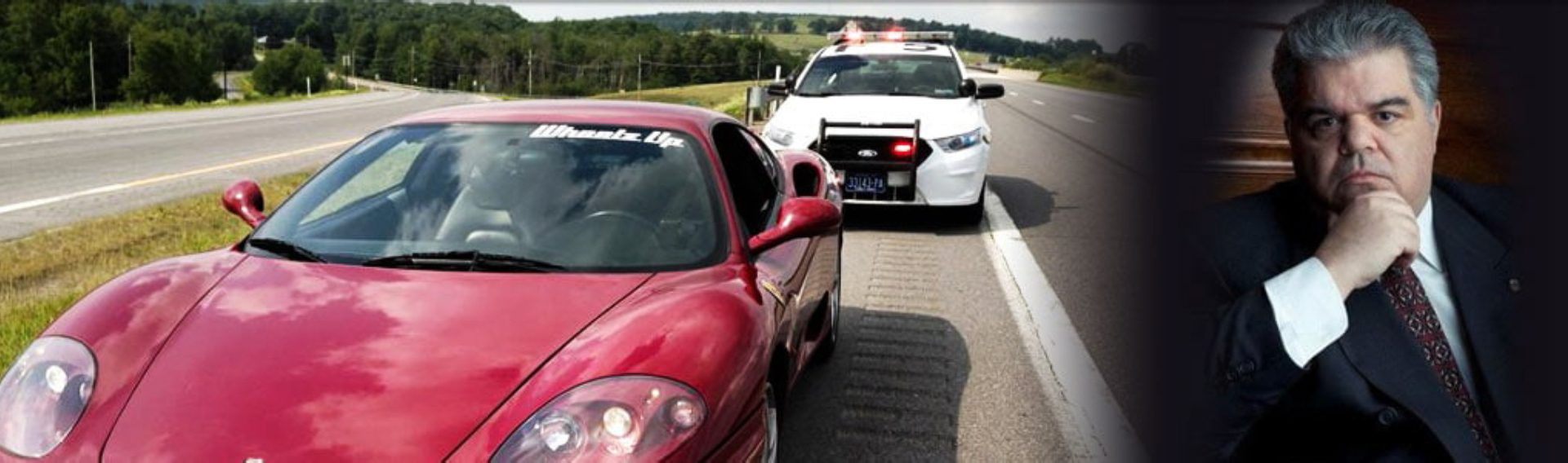 A red car is stopped on the side of the road.